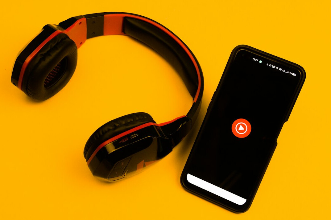 Podcast microphone and headphones in a cozy recording studio