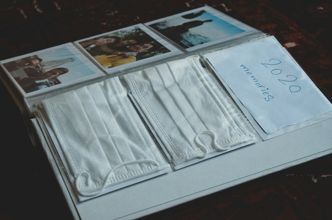 Folder labeled case file with photographs and a pen on a desk